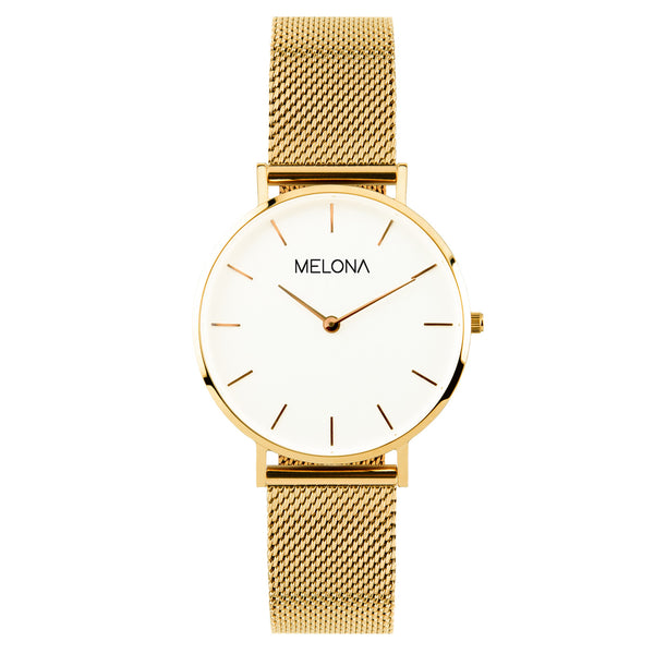 Reloj minimalista de mujer con correa de malla dorada y esfera blanca de la marca de joyería española Melona en colección Alma Mesh