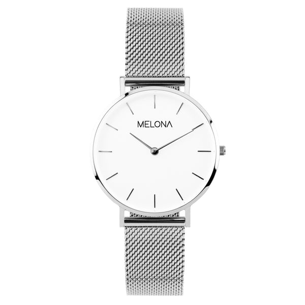 Reloj minimalista de mujer con correa plata de malla y esfera blanca de la marca de joyería española Melona en colección Alma Mesh