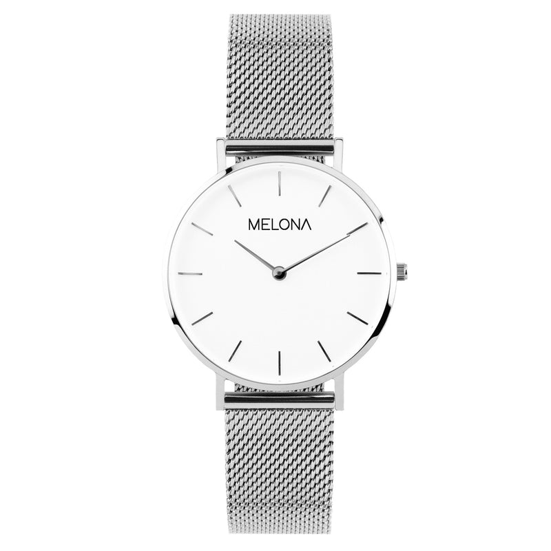 Reloj minimalista de mujer con correa plata de malla y esfera blanca de la marca de joyería española Melona en colección Alma Mesh