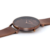 Reloj minimalista de mujer con correa de malla café y esfera café de la marca de joyería española Melona